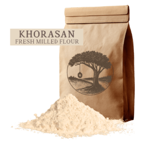 A bag of fresh-milled Khorasan flour from Kern River Milling, showcasing the golden hue of these healthy grains. Expert whole grain milling makes this one of the best whole grains for organic whole wheat bread. We ship throughout the United States."